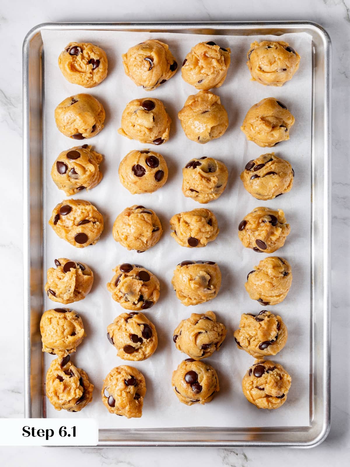 Sourdough cookie dough portioned into uniform balls before chilling.
