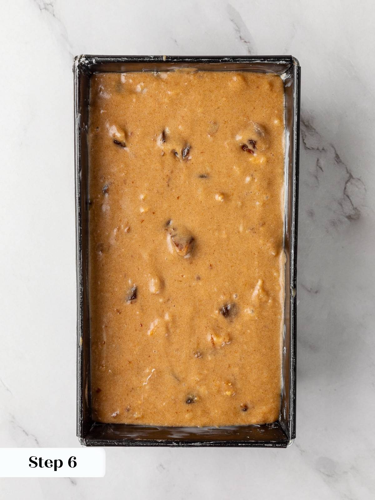 Date nut bread batter spread evenly in loaf pan before baking.