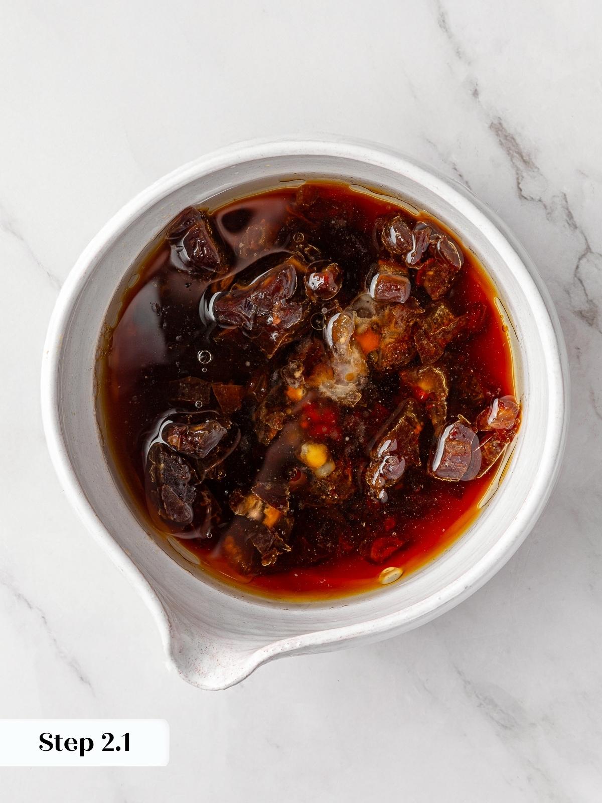 Dates softened in hot liquid to create rich flavor base.
