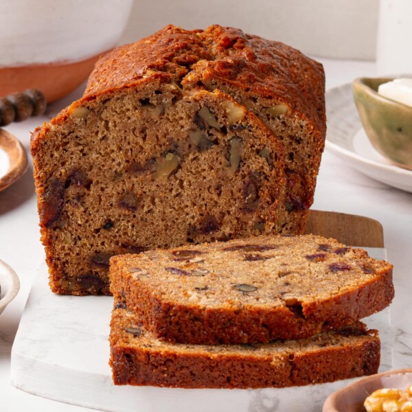 Several slices of date nut bread arranged for serving.