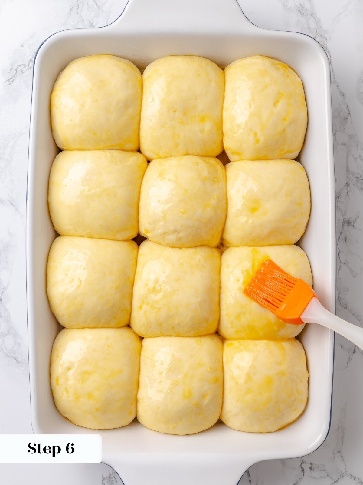 Egg wash brushed gently over proofed dough before baking.