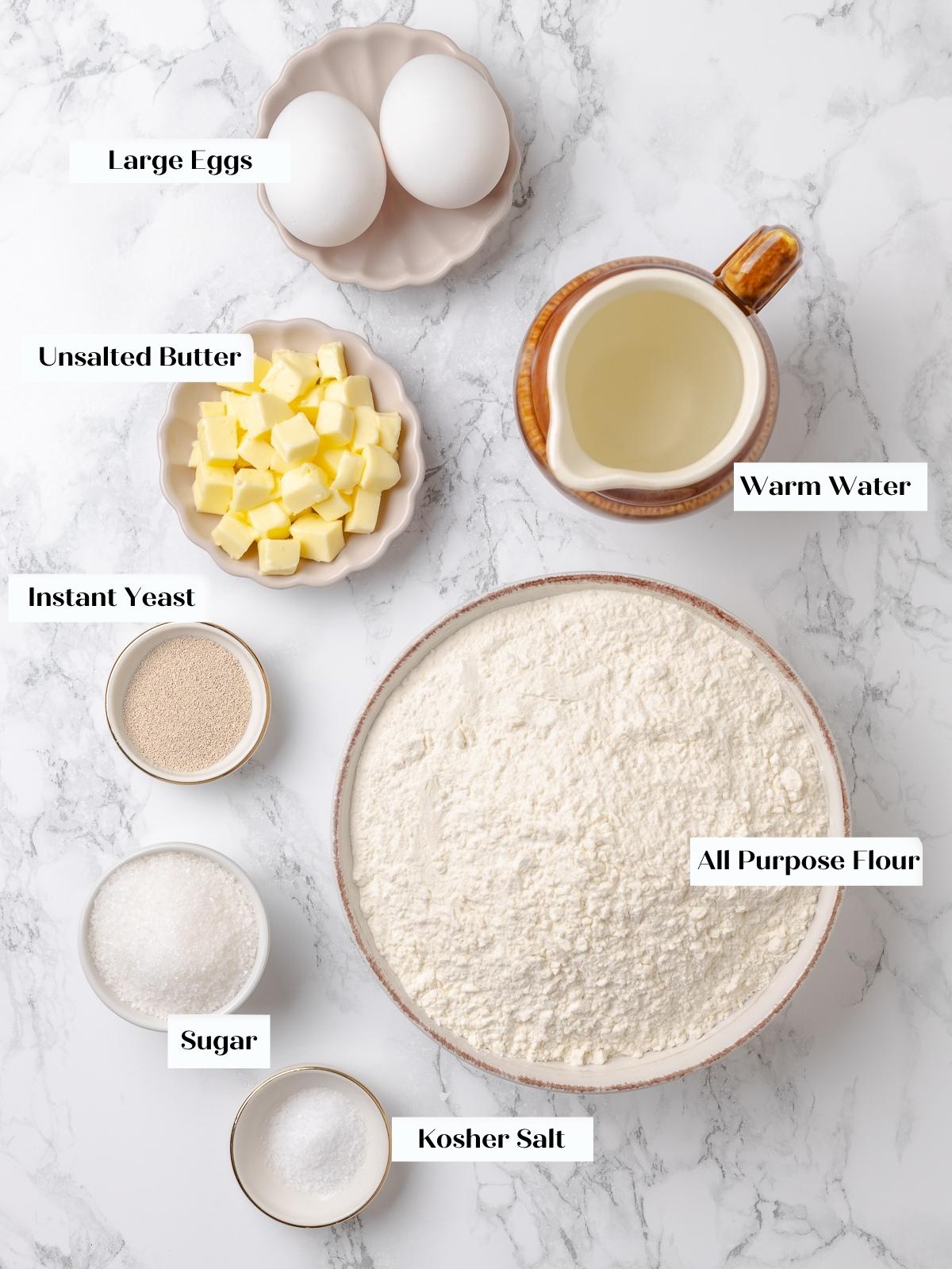 Dinner roll ingredients measured and arranged on countertop before mixing.