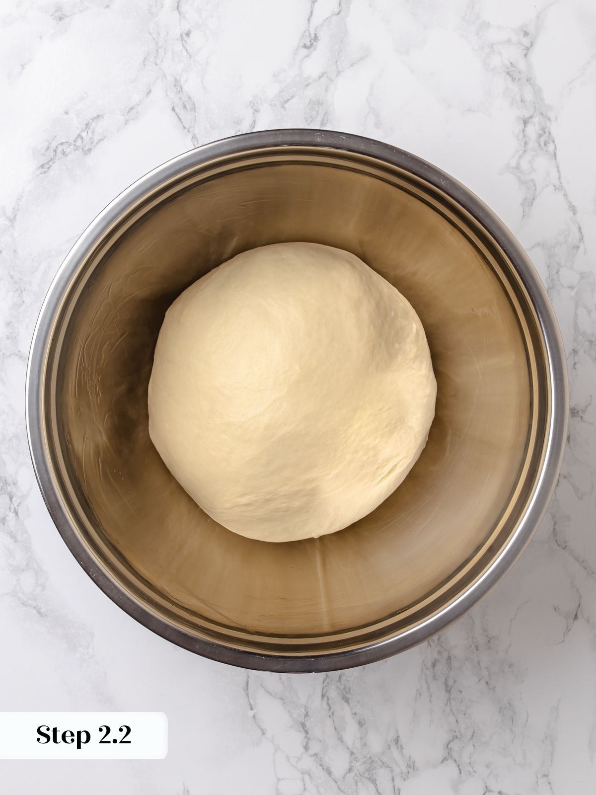 Fully kneaded dough smooth, elastic, and ready for first proof.