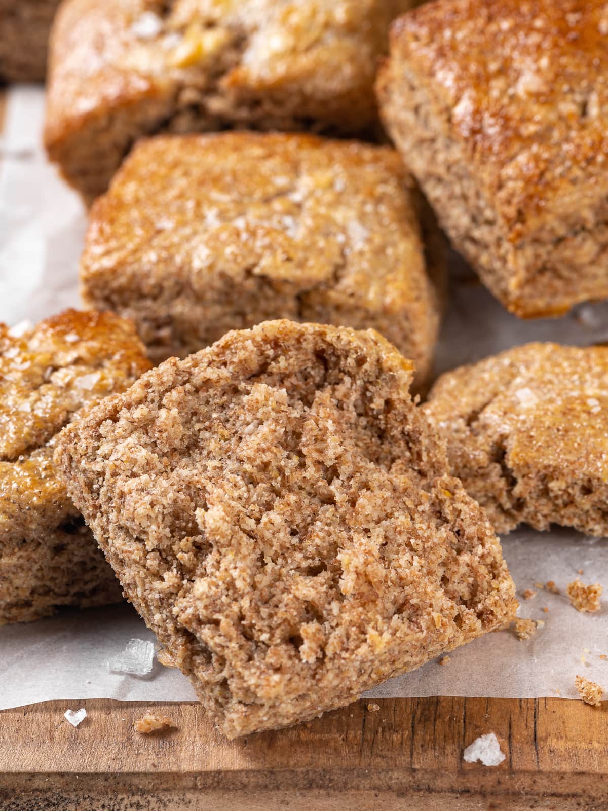 Split whole wheat biscuit revealing nutty interior and soft texture.