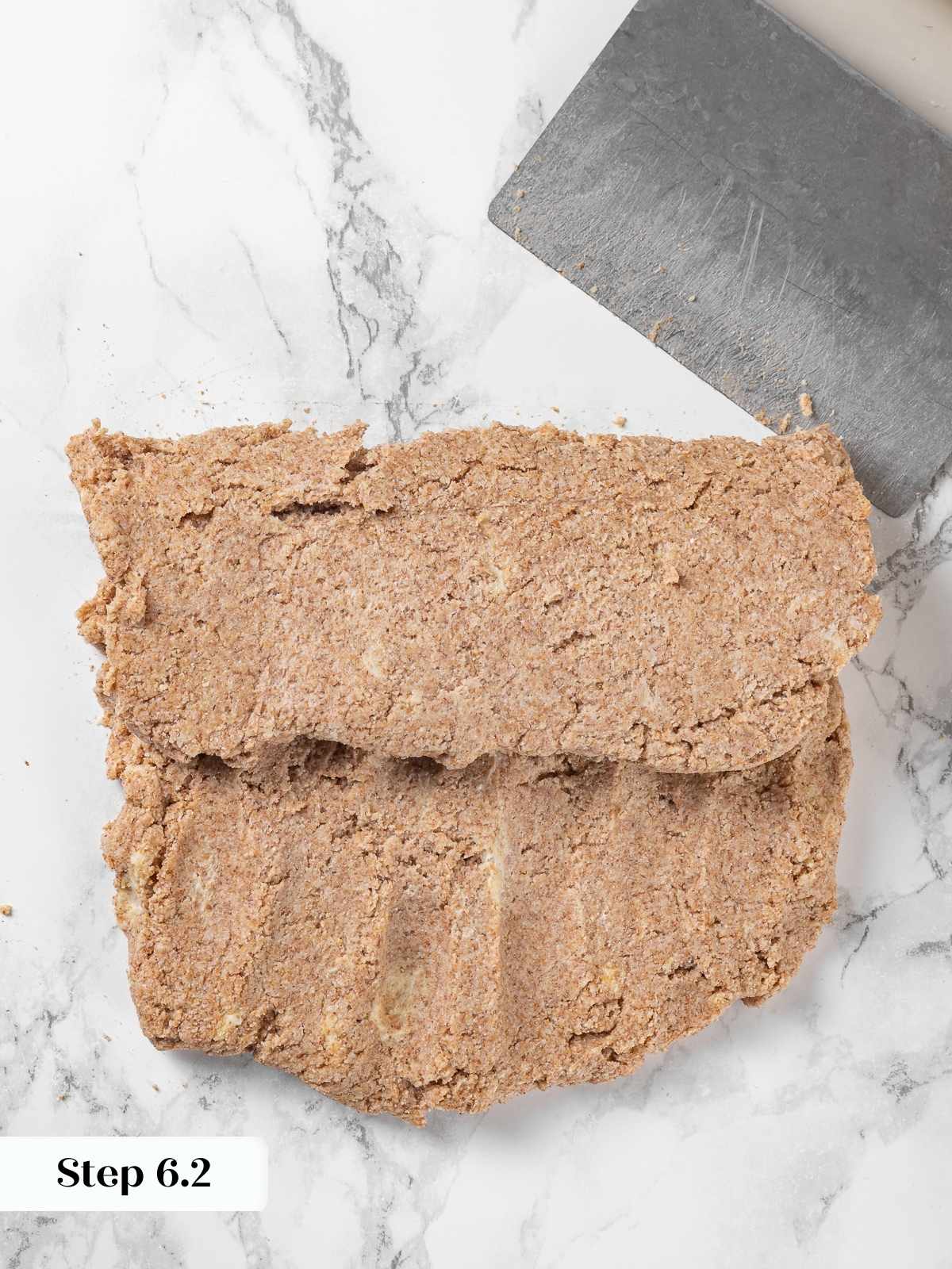 One-third fold completed during biscuit dough lamination.
