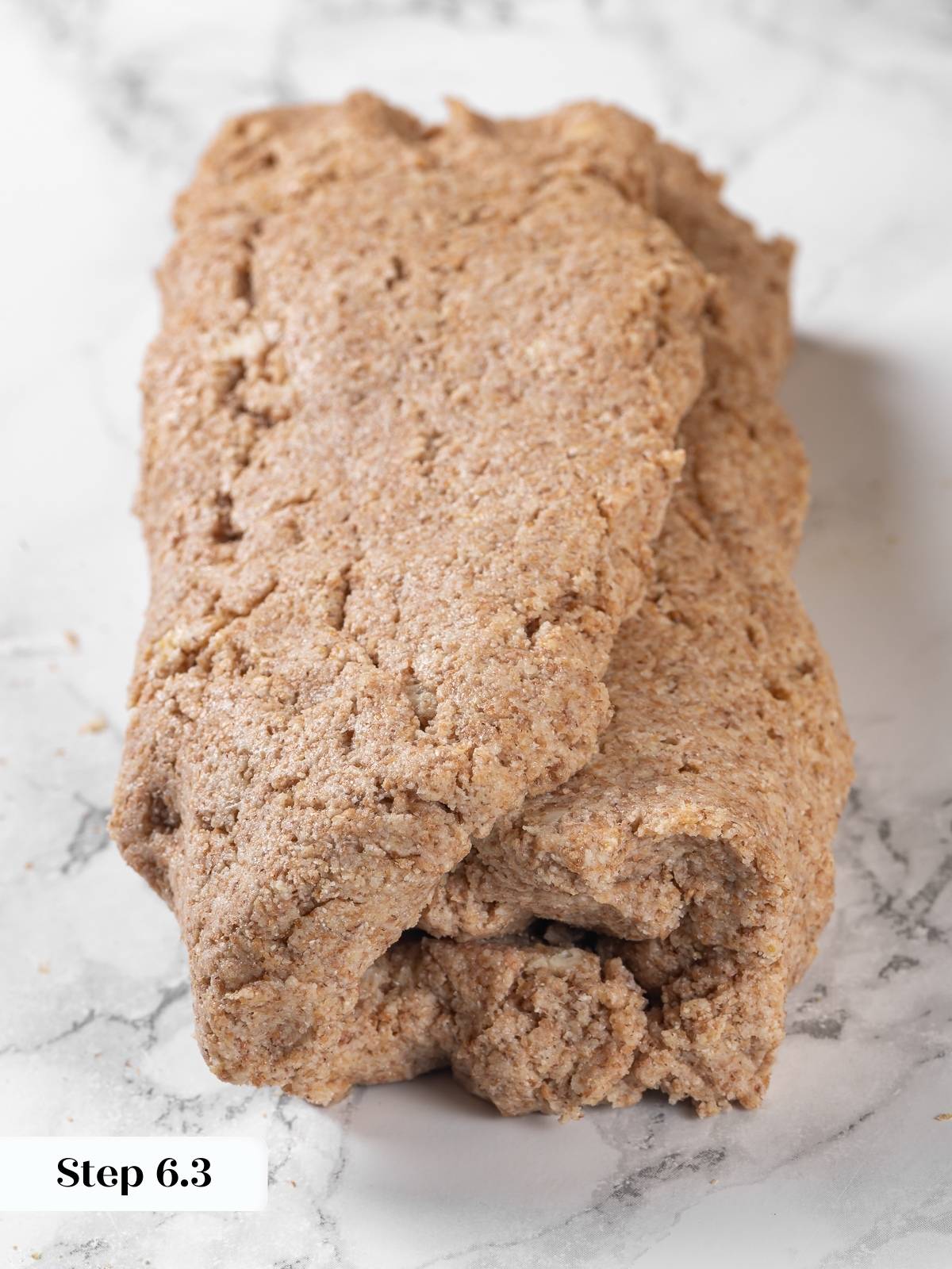Biscuit dough folded multiple times to build flaky layers.