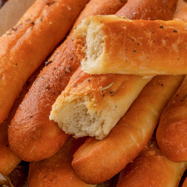 Herbed garlic breadsticks seasoned with oregano and garlic butter.