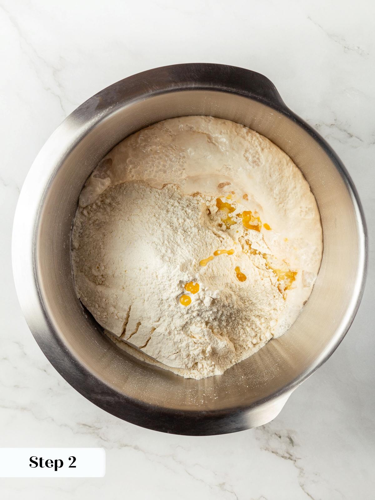 Ingredients gathered in mixing bowl before forming garlic breadstick dough.