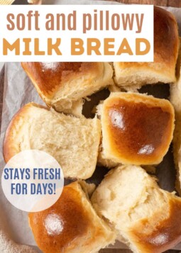 Soft & pillowy milk bread dinner rolls on parchment paper. Text overlay reads stays fresh for days.