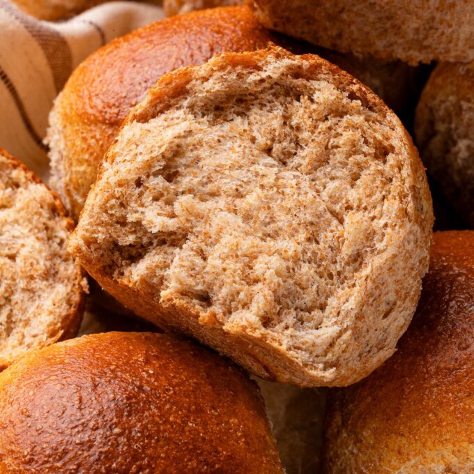 Whole wheat dinner roll showing fluffy interior crumb and tender texture.