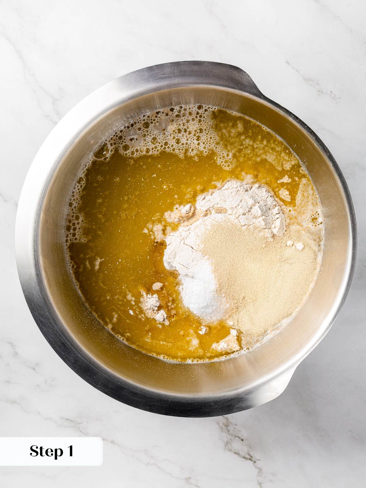 Flours yeast salt and water combined in bowl for focaccia dough.