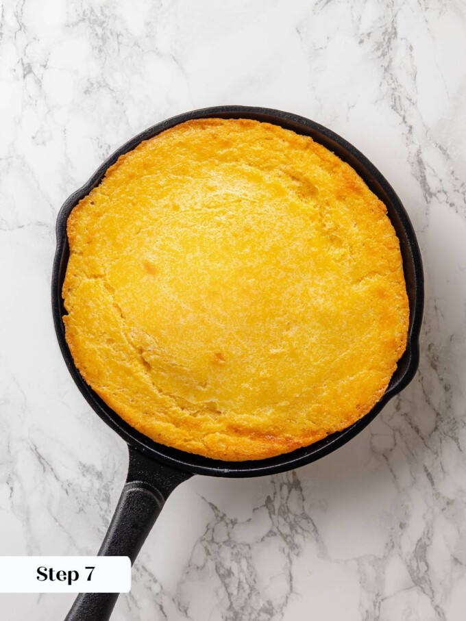 Finished sourdough cornbread baked in skillet with evenly browned top and crisp edges.