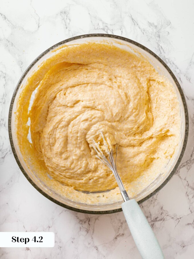Sourdough cornbread batter in mixing bowl showing smooth, thick consistency before baking.