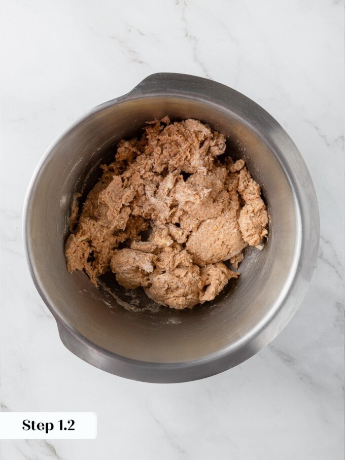 Early stage dough with rough, uneven surface before kneading smooths it out.
