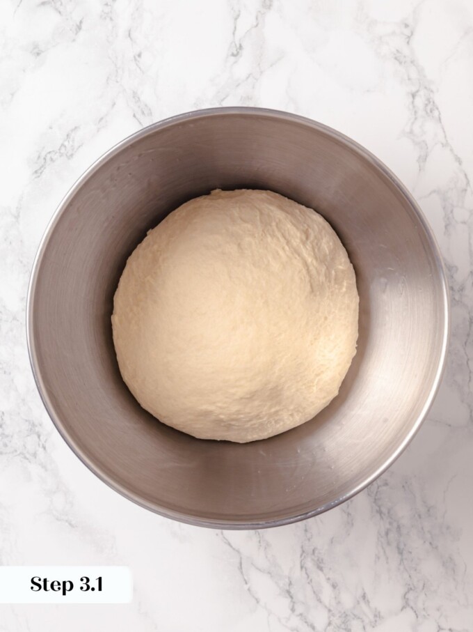 Compact buttermilk bread dough placed in greased bowl before warm spot rising.
