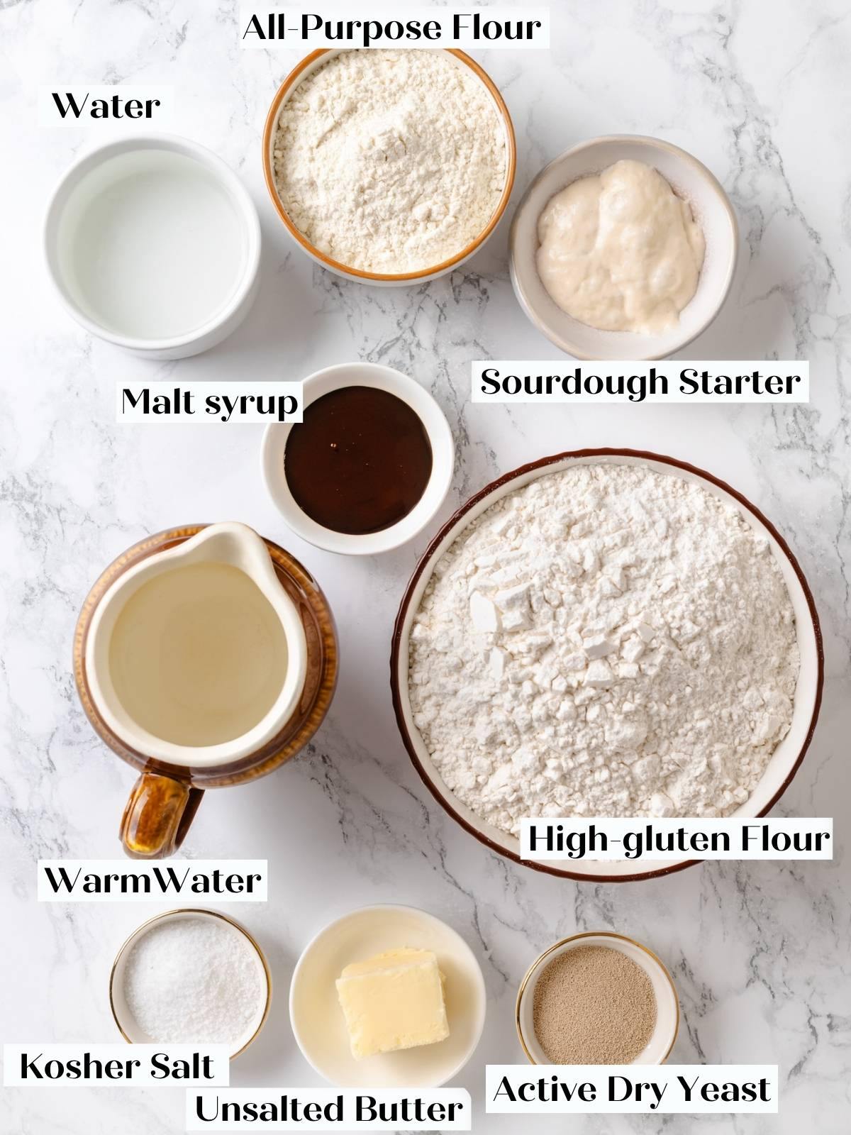 Labeled bowls of all-purpose flour, sourdough starter, malt syrup, high-gluten flour, water, butter, salt, and yeast.