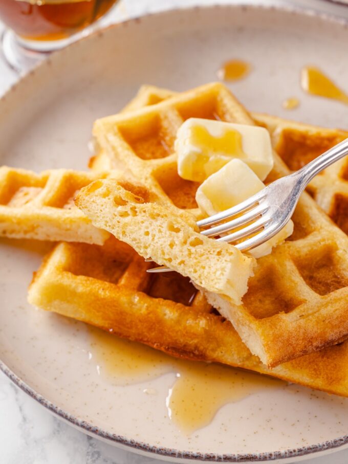 That open crumb shows the overnight yeast at work inside these light, crisp belgian waffles.