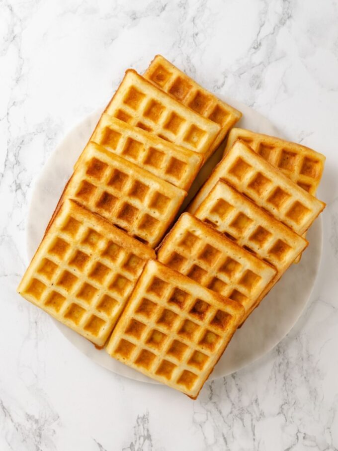 Straight from the iron, these belgian waffles show the deeply golden, crisp exterior yeast batter delivers.