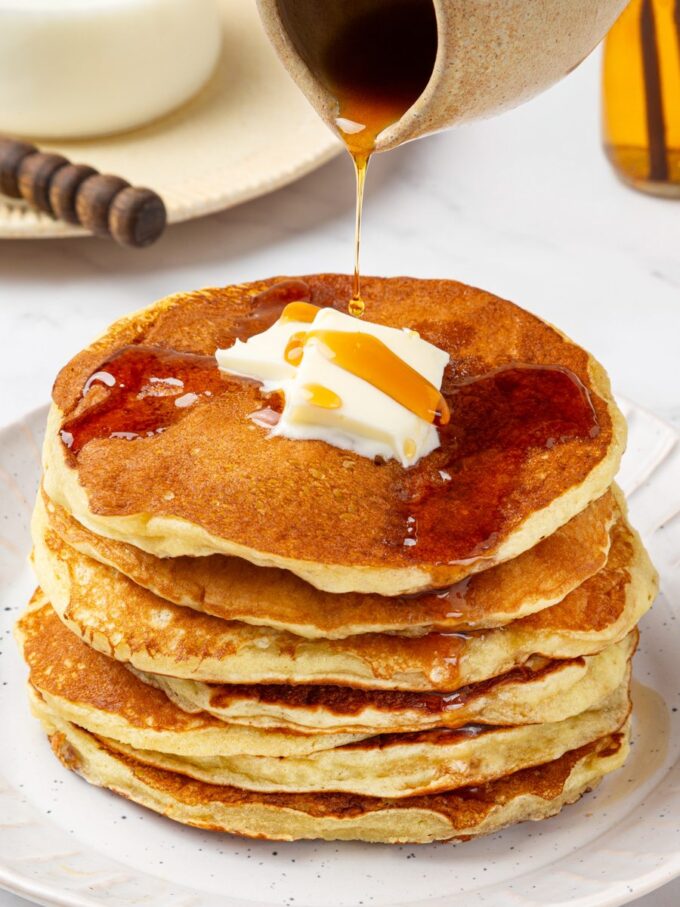 Pouring syrup over the warm stack is the classic way to serve this buttermilk pancake recipe.