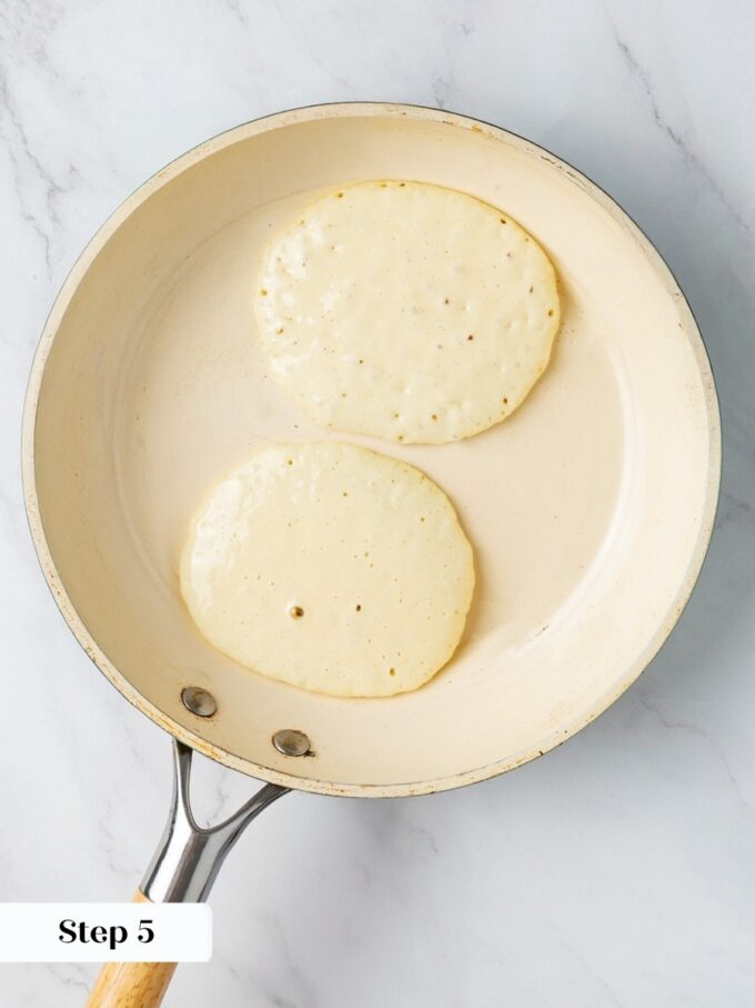 Bubbles popping in the center signal the perfect moment to flip in this buttermilk pancake recipe.