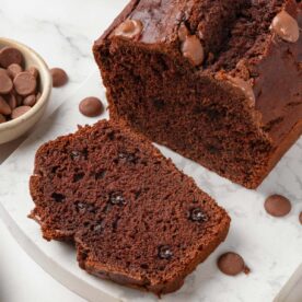 Melty chip pockets and a moist interior show why gluten free chocolate banana bread satisfies.