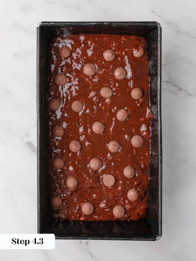 Lining the pan with parchment makes lifting the baked gluten free chocolate banana bread out cleanly.