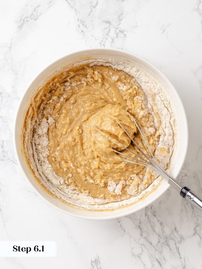 Stop mixing as streaks vanish; over-whisking now would toughen the tender peanut butter bread crumb.