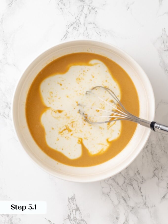 Adding warm milk keeps the coconut oil from seizing, protecting this peanut butter bread's tender texture.