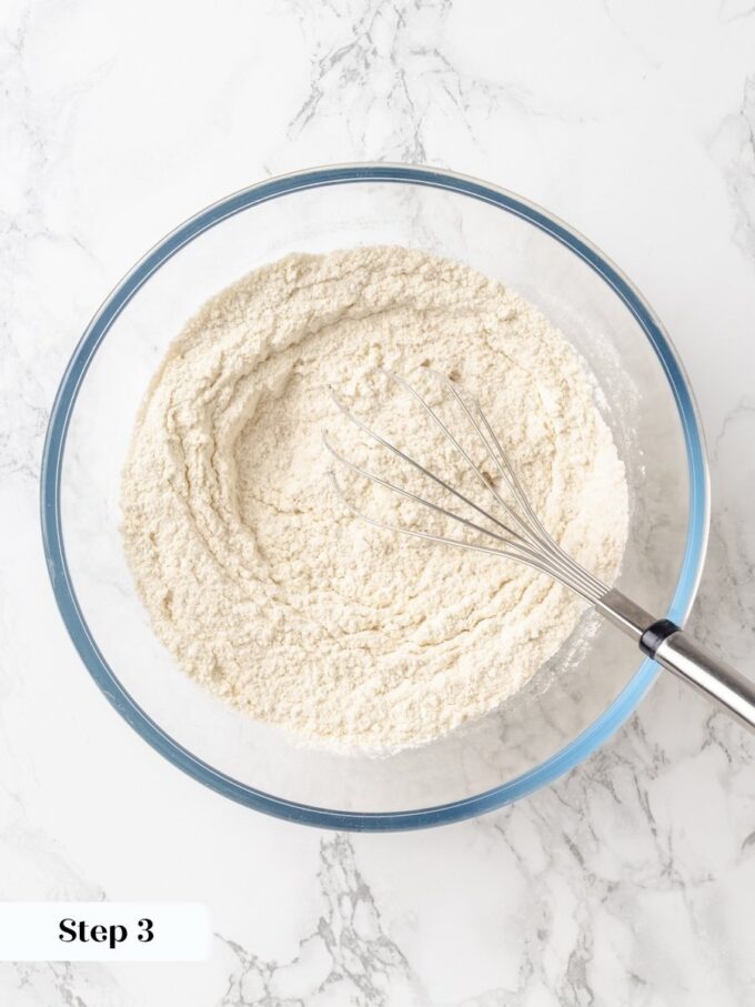 Whisking the dry ingredients first ensures even sugar distribution for a tender peanut butter bread crumb.