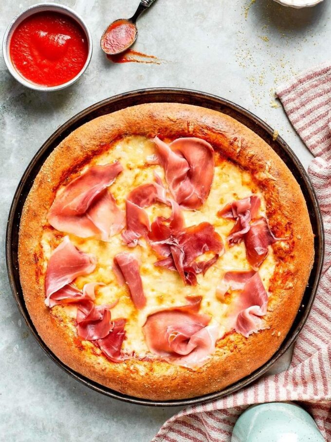 Mozzarella piles on and this whole wheat pizza dough holds it all without going soggy.