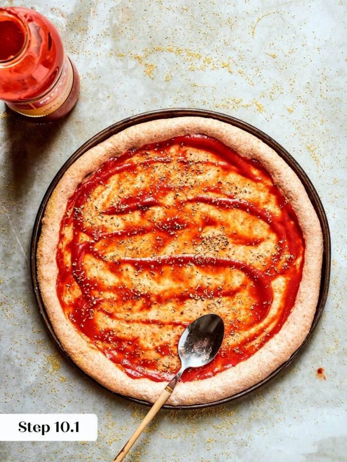 Sauce goes on thin so the whole wheat pizza dough crust stays crisp, not soggy.