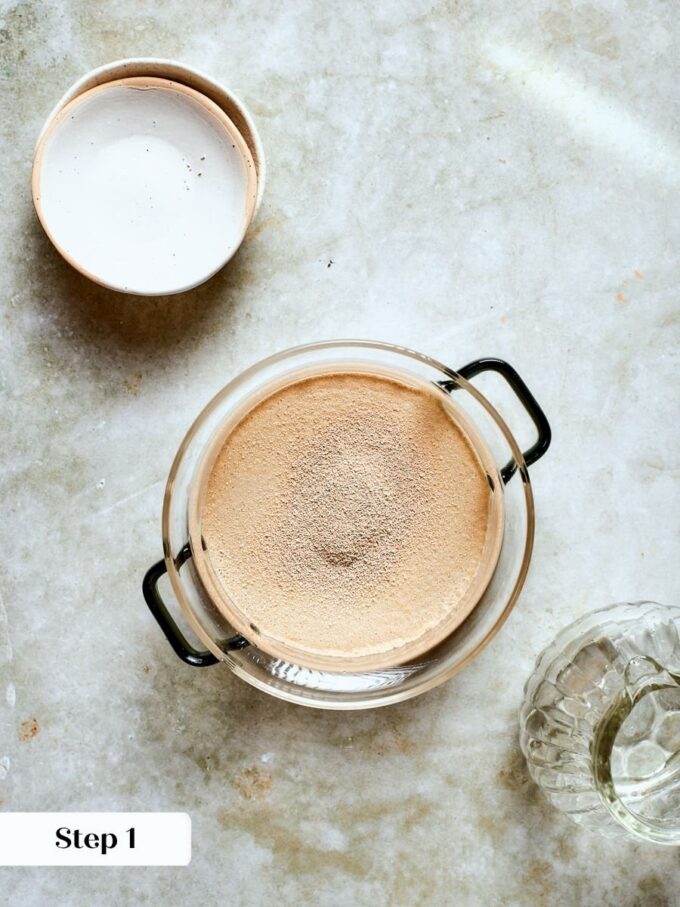 Proofing the yeast guarantees an airy rise that keeps this whole wheat pizza dough light.