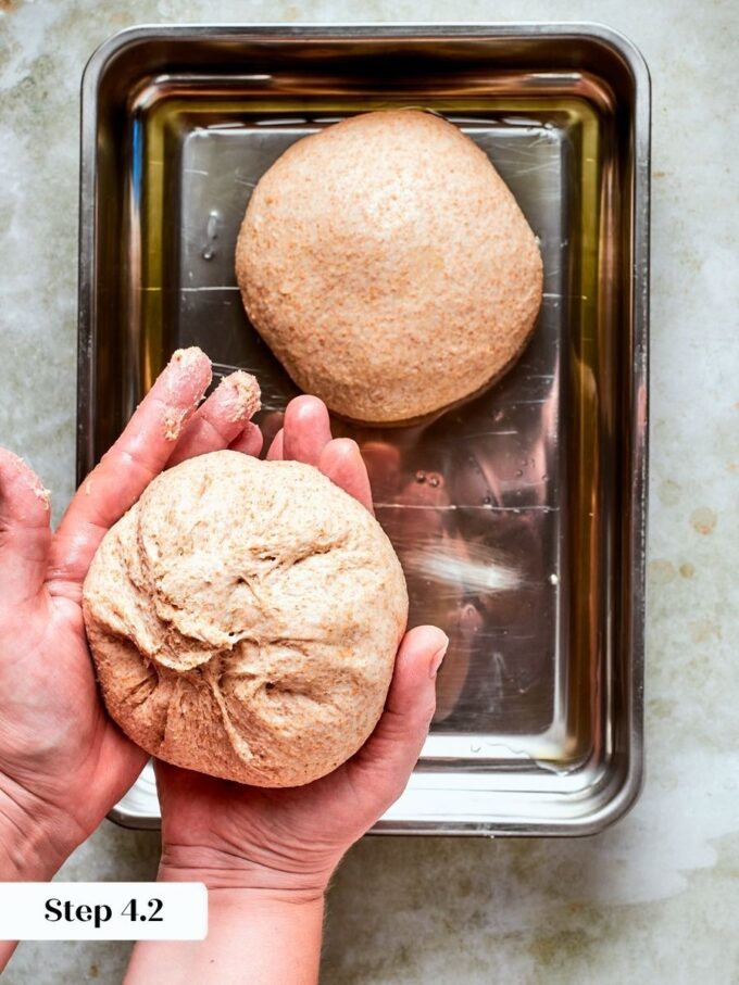 Building tension on the dough ball gives whole wheat pizza dough a smooth, even rise.