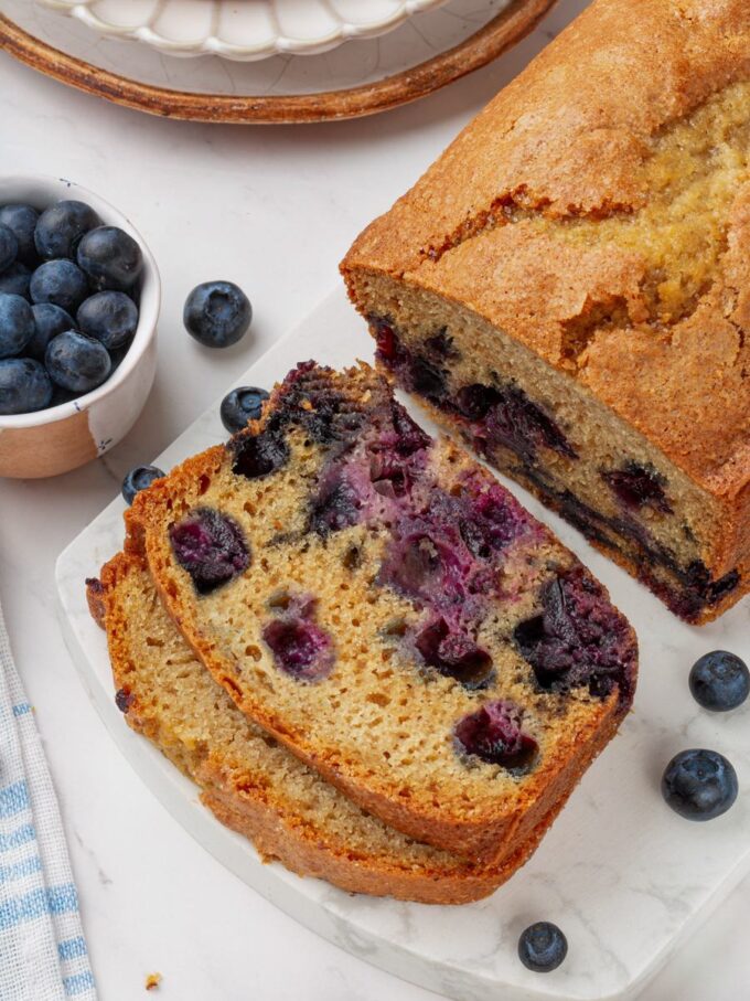This angle highlights the even berry spread that defines a well-made blueberry bread loaf.
