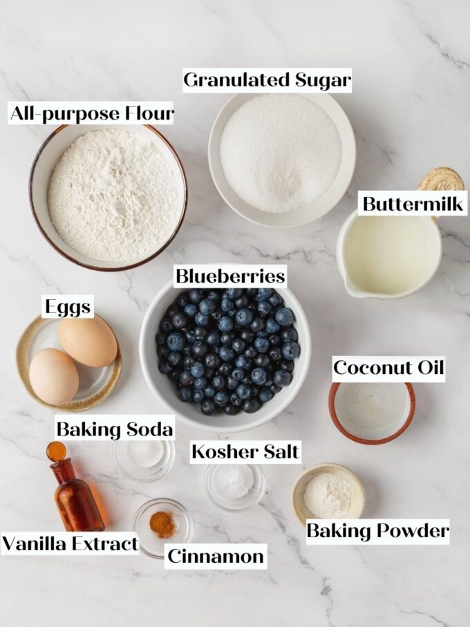Every labeled component blueberry bread needs sits ready on marble before mixing the batter.