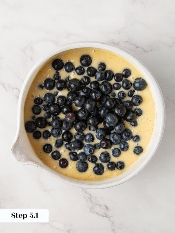 A generous quantity of berries ensures each slice of blueberry bread bursts with fruit.