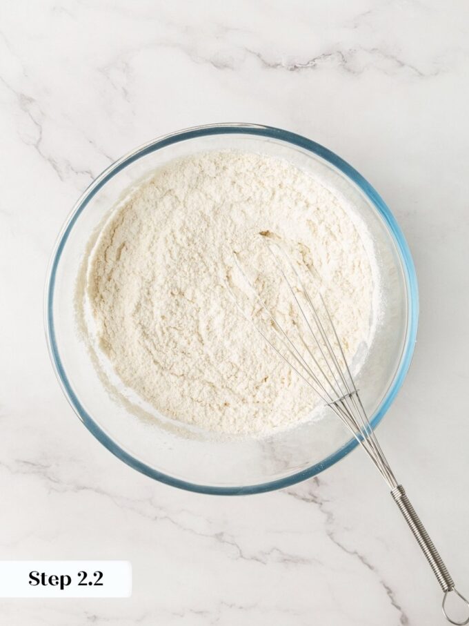 Evenly combined dry ingredients ensure the cinnamon and leavening distribute throughout every slice of blueberry bread.