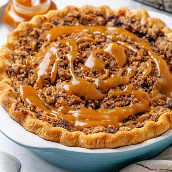 A square crop suits social feeds and shows the double-caramel finish of this caramel apple pie.