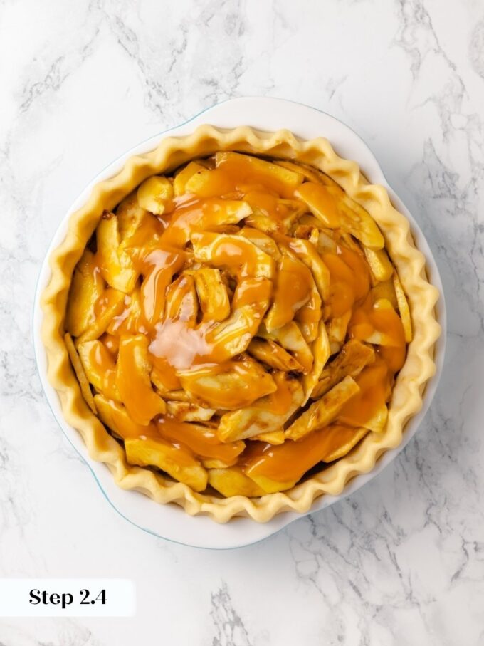 The first caramel layer soaks into the apples as they bake in this caramel apple pie.