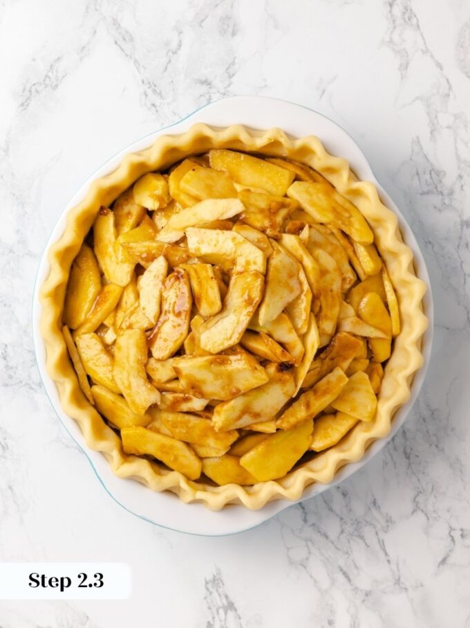 Mounding the apples high leaves room to settle, so this caramel apple pie bakes level.