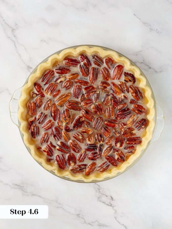 Pouring slowly keeps the two pumpkin pecan pie layers separate rather than swirling them together.