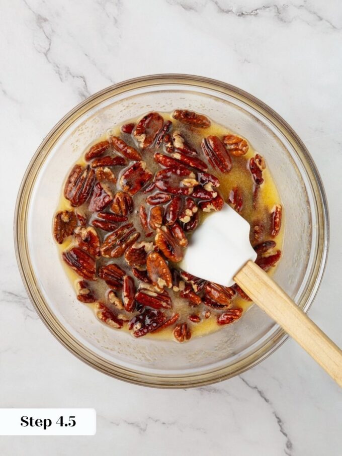 Coating every pecan half in filling keeps the pumpkin pecan pie topping evenly spread while baking.
