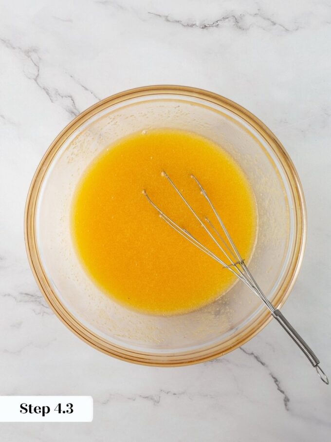 Whisking until fully combined keeps the pumpkin pecan pie topping glossy rather than grainy or separated.
