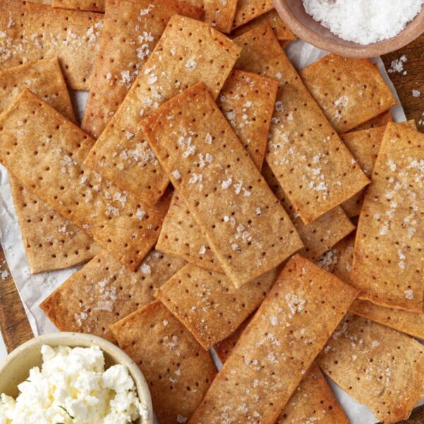 Ricotta and flaky salt are the classic partners for tangy, rye-forward sourdough crispbread.