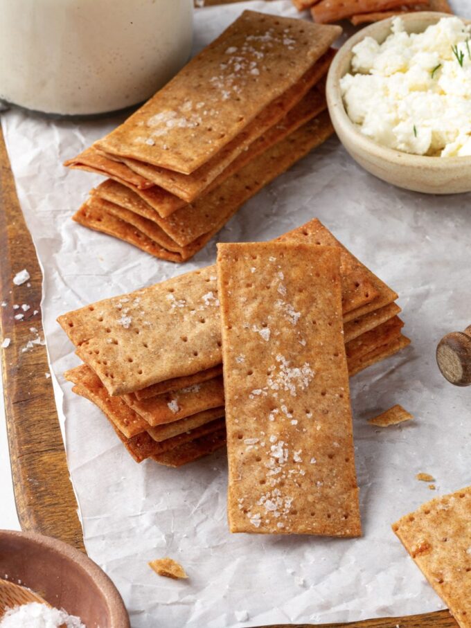 Stacked on edge, sourdough crispbread reveals just how paper-thin the parchment rolling method gets.