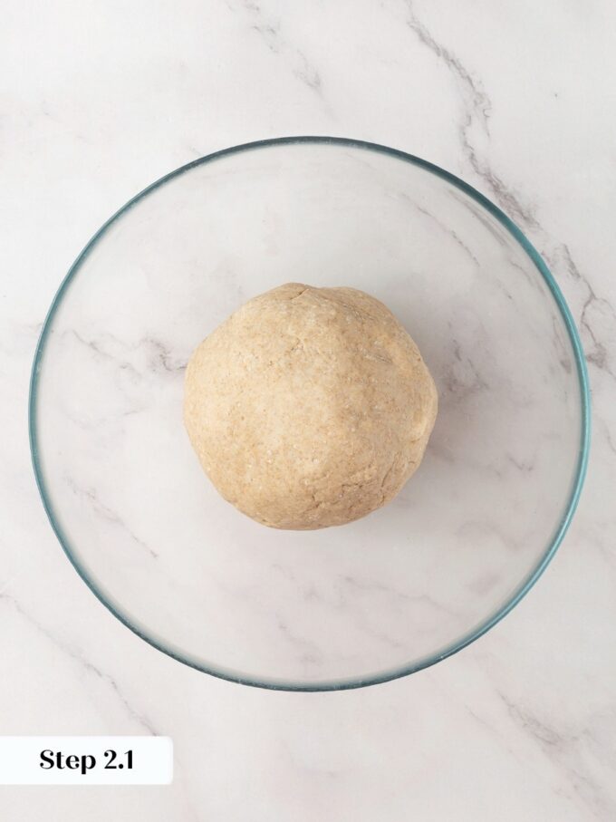 Covering the bowl now lets sourdough crispbread dough relax before the long room-temperature ferment begins.