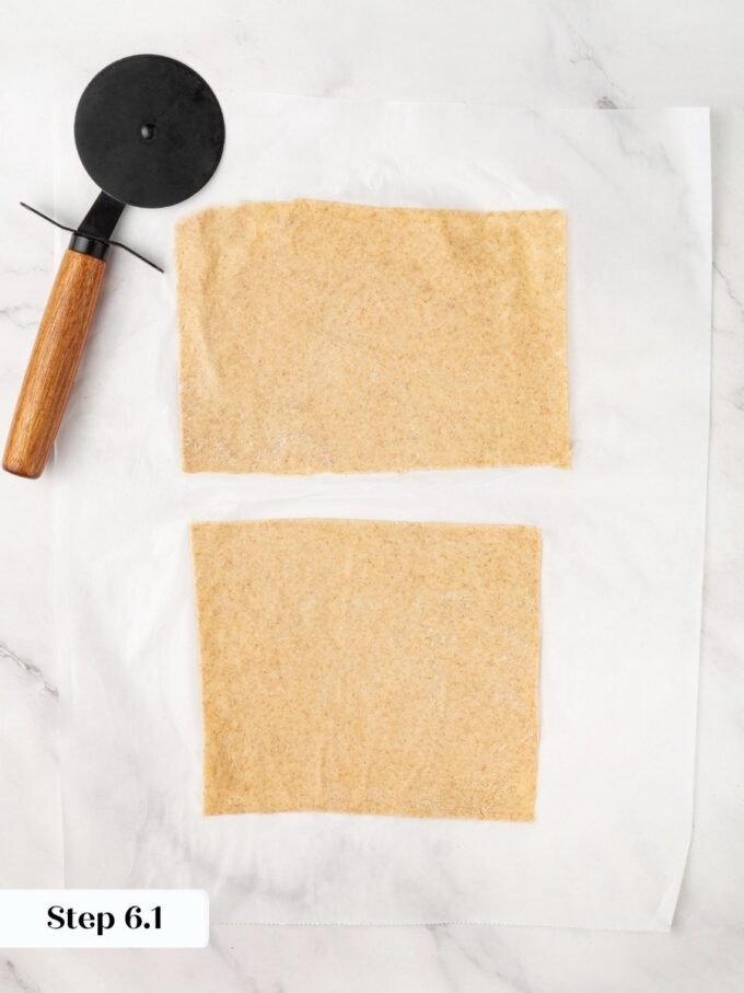 Trimming the ragged edges is optional, but it gives sourdough crispbread clean bakery-straight sides.