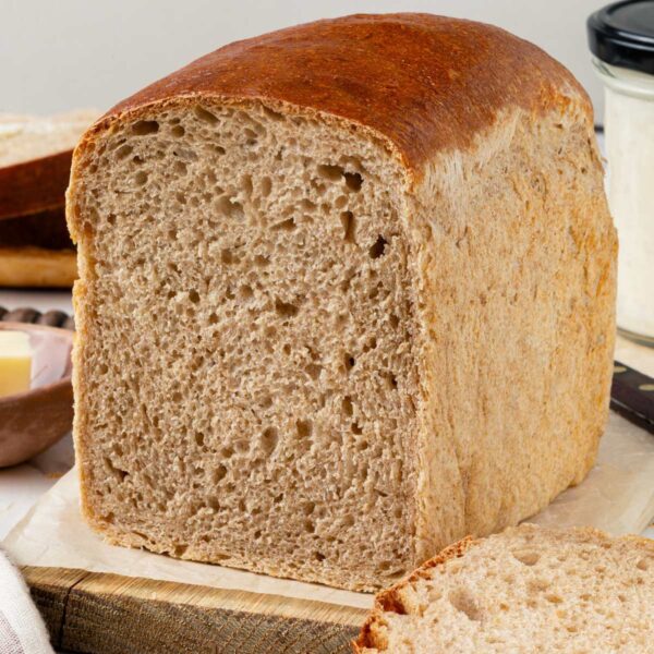 Baking in a loaf pan is what gives sourdough rye bread these flat, even sides.