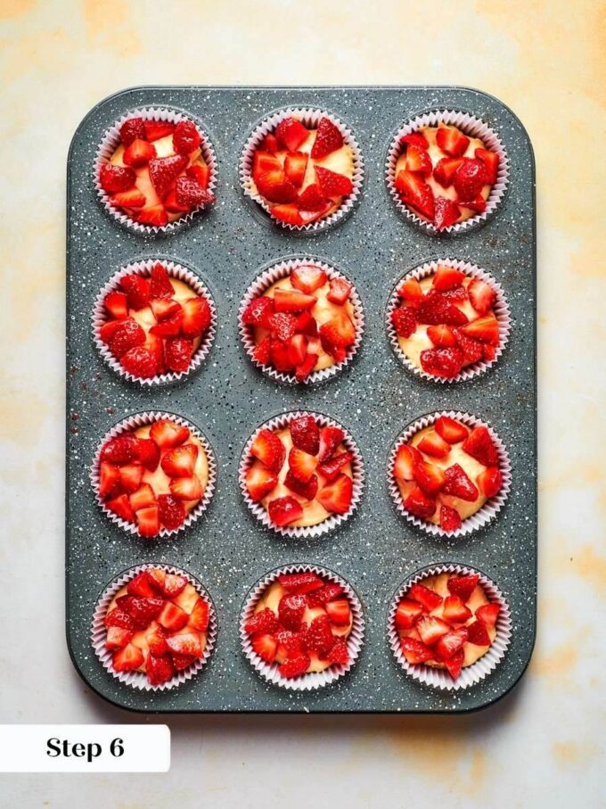 Scattering strawberries on top rather than folding keeps this strawberry muffin recipe juicy, not soggy.