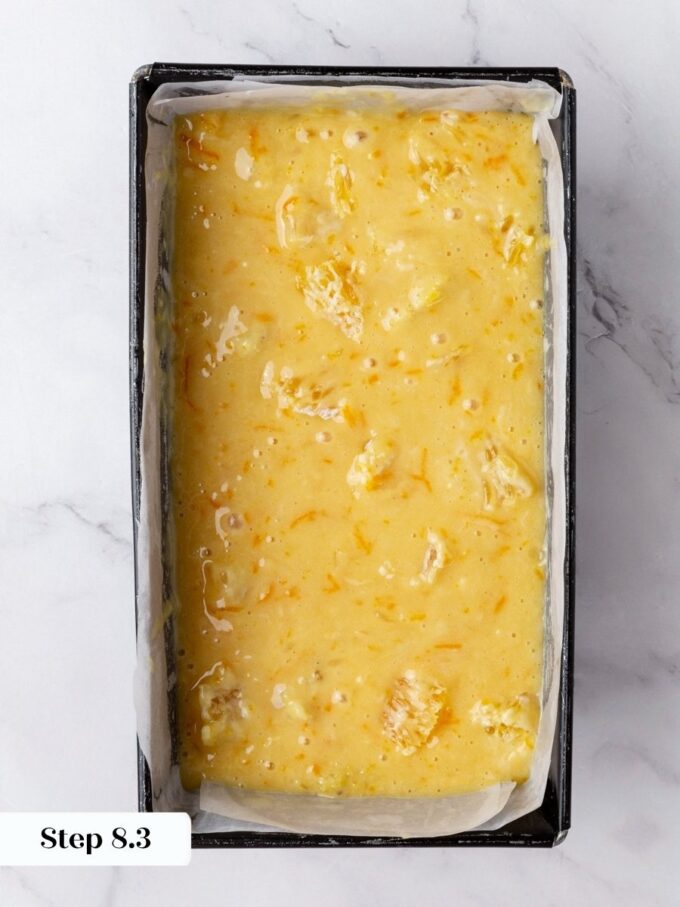 Keeping the fruit-heavy batter toward the top stops segments settling at the base of orange bread.
